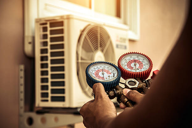 Professional Air Conditioning Service technician working in Andover, MA